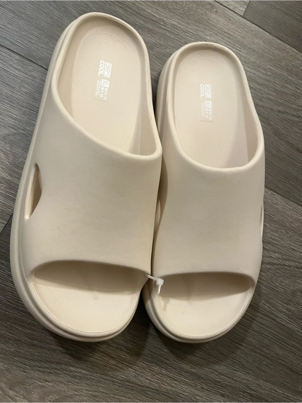 Degrees cushion slide sandals featuring a minimalist, smooth slip-on design.